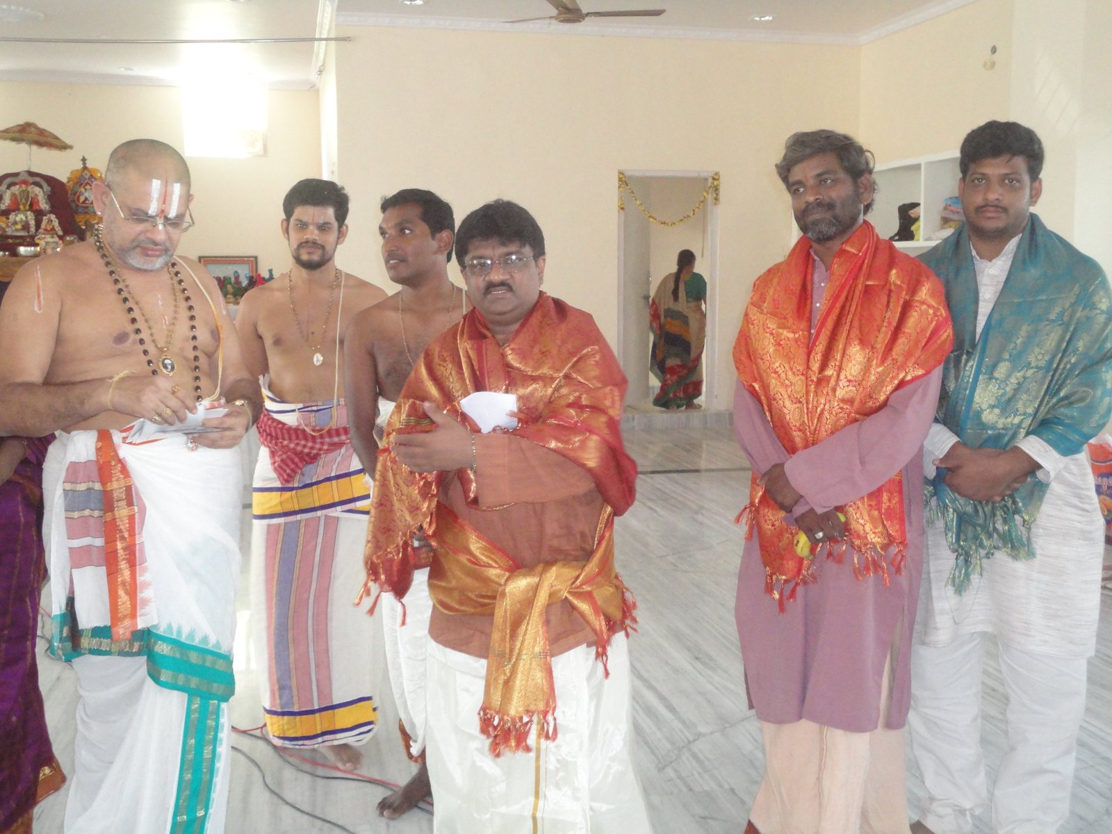 Dr. Tyagaraj receiving a ceremonial honour alongside spiritual and cultural leaders