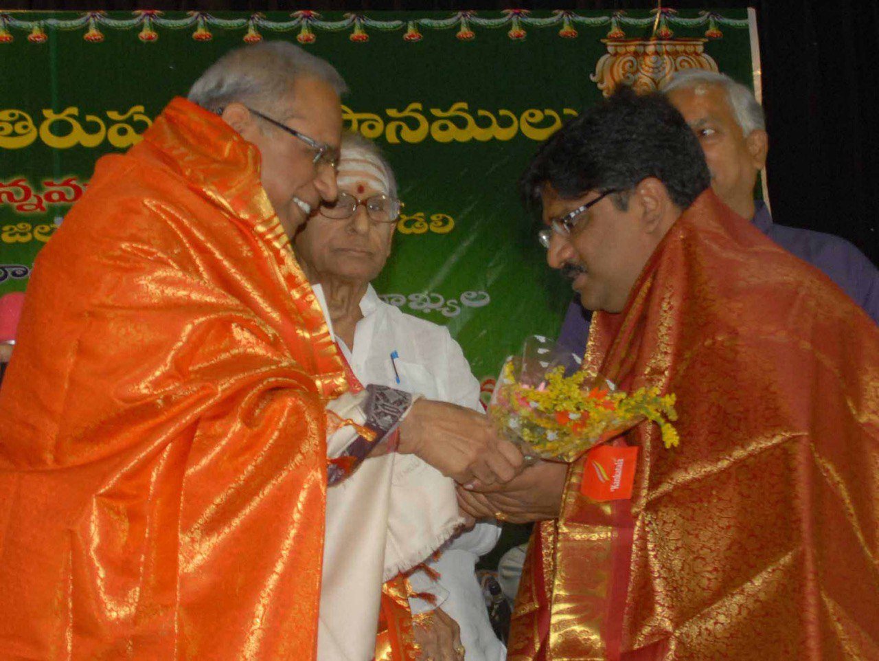 Dr. Tyagaraj being felicitated by Sri Garimella Balakrishna Prasad