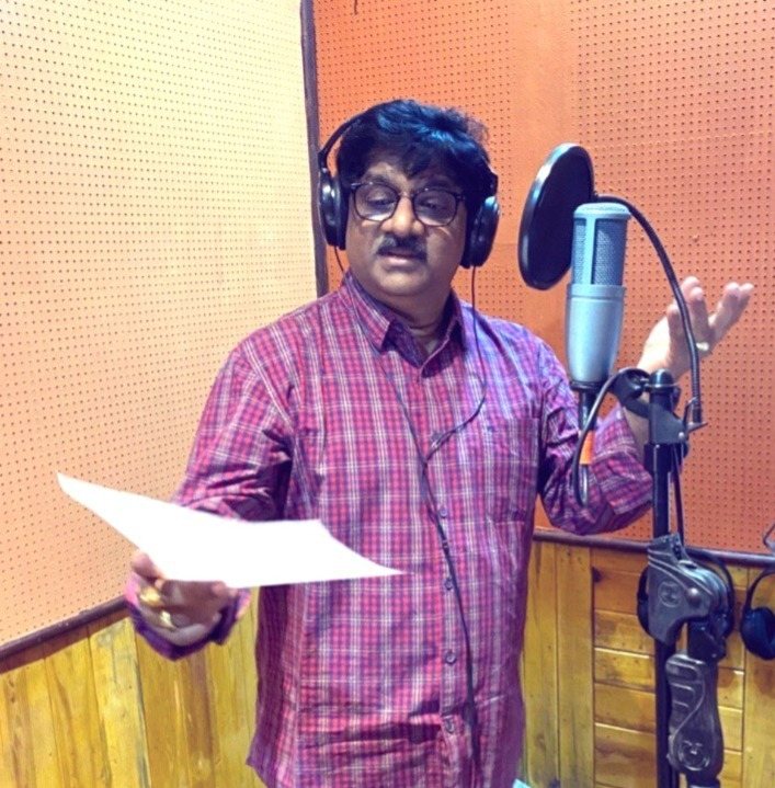 Dr. Tyagaraj singing in a recording studio